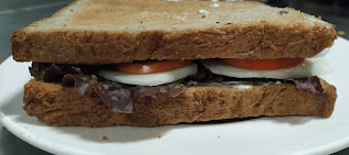 Two brown bread with vegetables inside for veg club sandwich recipe