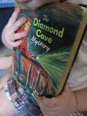 younger lass holding Troy Nesbit's Diamond Cave Mystery