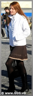 Girl in skirt and white jacket 