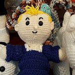 http://www.ravelry.com/patterns/library/helenmay-crochet-girl-and-boy-doll
