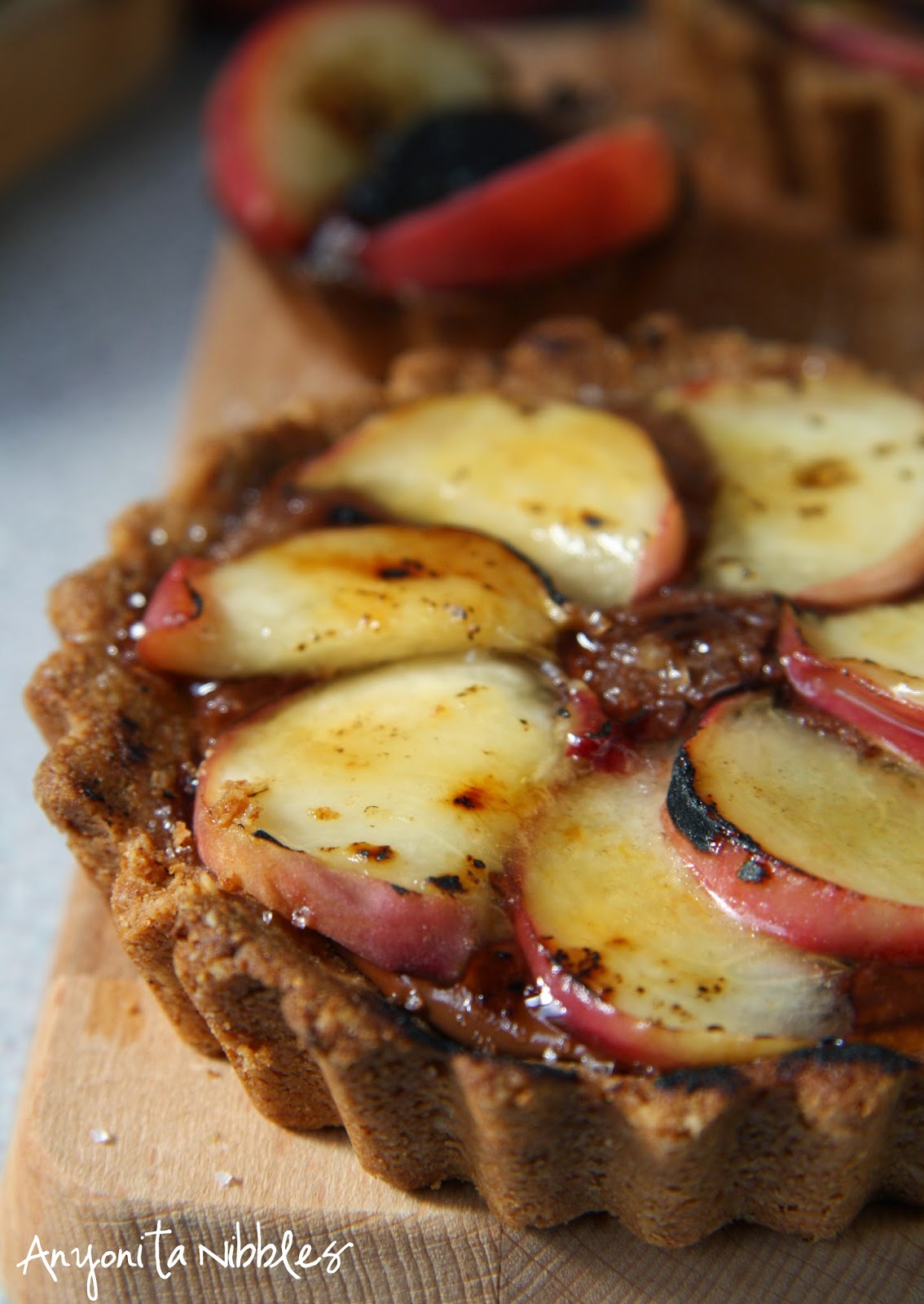 Lightly burnished peaches in a peach & Nutella tart by Anyonita Nibbles