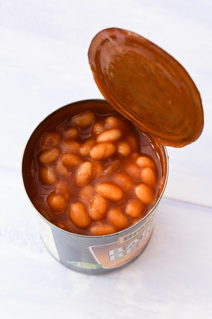 an open tin of baked beans