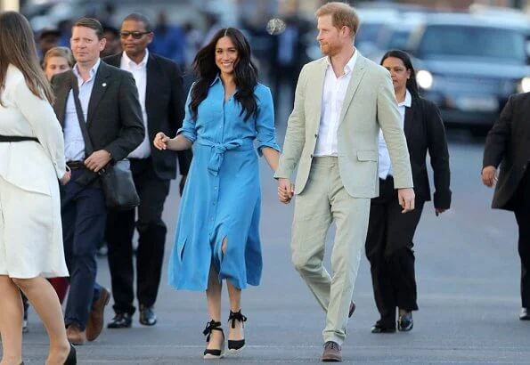 Meghan Markle wore Veronica Beard Sky Blue Cara dress. Duchess is in the same dress she wore on tour in Tonga