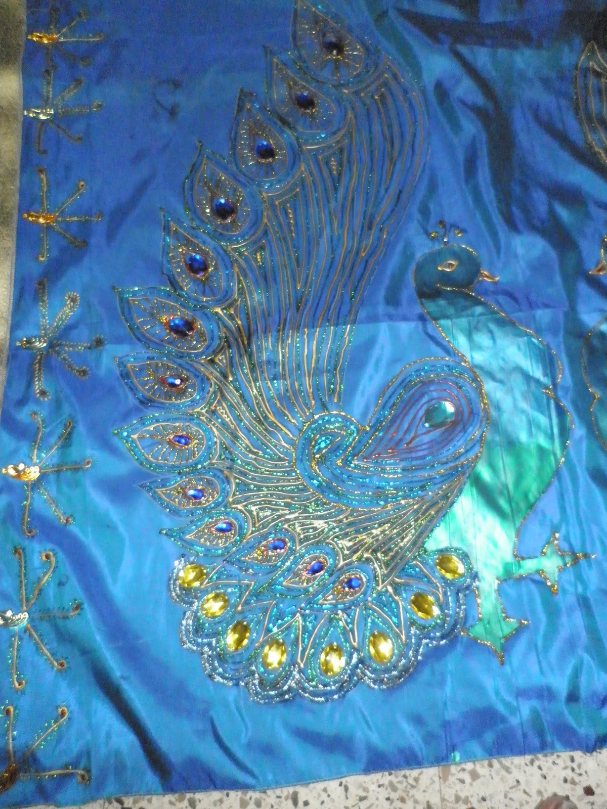 Saree with Peacock Design in Glitter Painting
