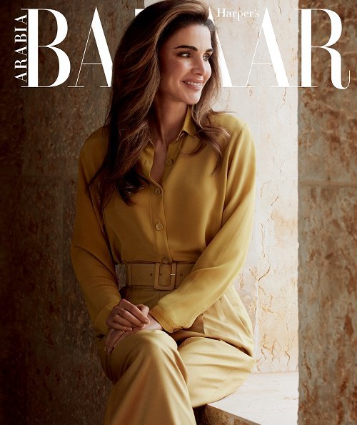 Queen Rania wore a Layeur Barbara slouch collar tie top and wide-leg trousers, and a cream jumper and skirt by Hugo Boss