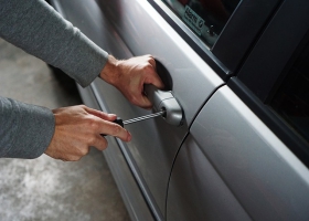 Breaking in into a car. Breaking in into a car.