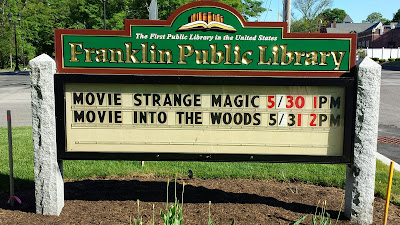 Library sign announces movies for May 30 and May 31