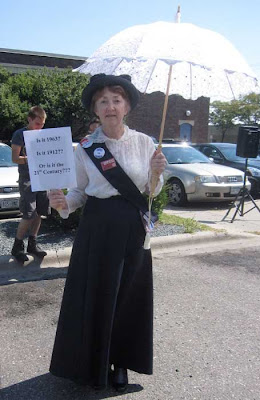 Woman dressed as a suffragist
