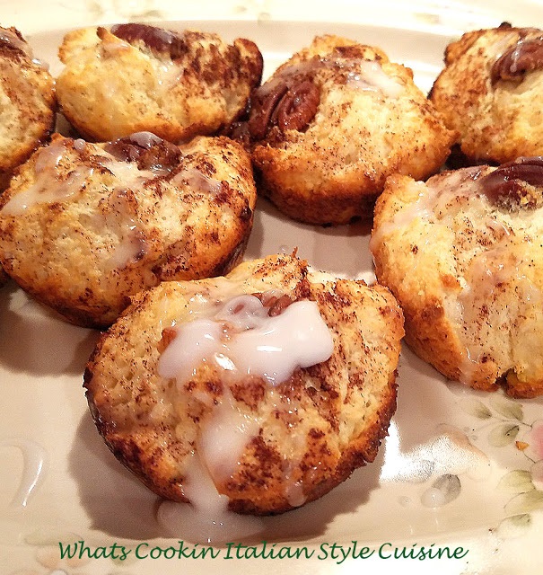 these are biscuit cinnamon rolls made in a cupcake tin. These biscuit cinnamon rolls are a semi homemade roll using a mix. The muffins are topped with cinnamon sugar, a glaze and pecans