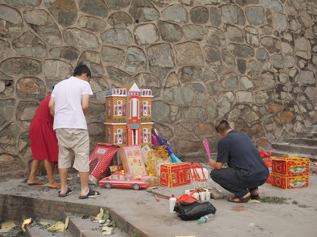 paper house and car replicas for burning