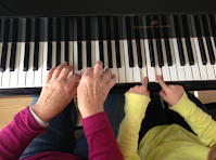 parent child playing digital piano