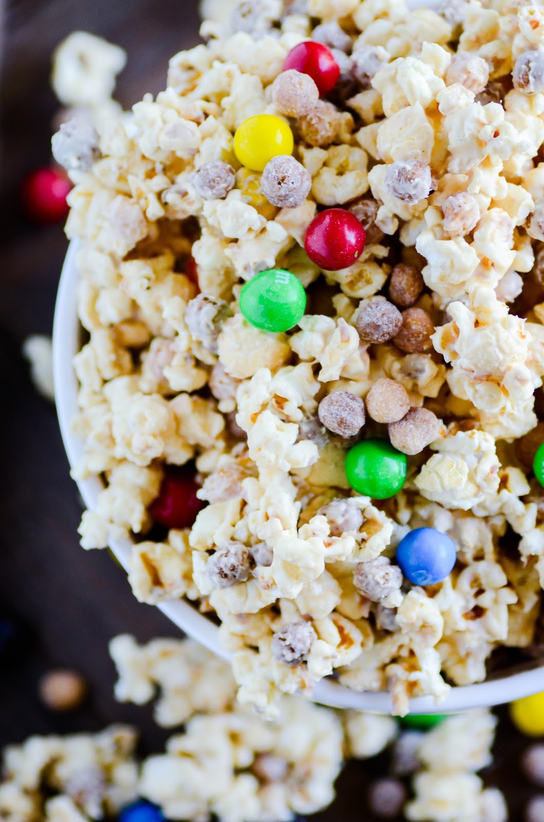 Crunchy, creamy, sweet and peanut butter-y snack mix filled with Reese's Puffs, kettle corn, and Pretzel M&Ms. Ready in under 30 minutes, and you won’t be able to put it down!