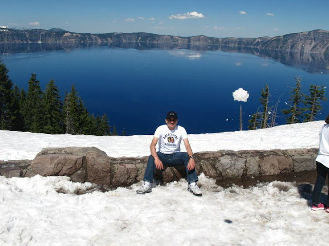 Crater Lake in Oregon, USA - A Wonderful PHOTO JOURNEY WITH Saurabh RathoreSaurabh visited Carter Lake few weeks back with his friends and they did camping around the lake. Let's have a PHOTO JOURNEY to Crater Lake with Saurabh...Crater Lake is a caldera lake located in the south-central region of the U.S. state of Oregon. It is the main feature of Crater Lake National Park and famous for its deep blue color and water clarity. The lake partly fills a nearly 2,148-foot (655 m) deep caldera that was formed around 7,700 (± 150) years ago by the collapse of the volcano Mount Mazama. There are no rivers flowing into or out of the lake; the evaporation is compensated for by rain and snowfall at a rate such that the total amount of water is replaced every 250 years. [Source: Wikipedia]Conquering the lake. The mountains look almost blue and the entire scenery has only two colours: Various shades of blue and white.Getting ready to camp in the wilderness. There's no feeling more liberating. Despite the snow, there was no need to cover oneself under layers of clothes.Camps all ready. T-shirts amongst the snow. Sounds like a bollywood concept. I think this is the Wizard island. It puts its head out through the waters. The color of the vegetation is darker. The site is considered sacred by the klamath tribe of Native Americans. Their ancestors are supposed to have witnessed the collapse of the maountain. The trek seems easy in pictures but wasn't without its own difficulties.Pine trees jutting out of the untouched blanket of snow. A sight very common in these surroundings. This looks like the original surface of Mount Mazama whose collapse had formed the crater. I can't be sure though. Look at the layers of snow behind. It seems that the snow in these parts of the world hasn't melted in centuries.The road appears more snake like in this area than any other because it's blackness is emphasized by the white surroundings.The round shape of the crater is very clear here. It is amazing how nature seems to favour round and spherical things. Our vehicle - comfortable and elegant - perfect for such terrain.This looks like fresh snow. I still  cannot understand the comparatively warm temperatures.The rocky terrain is mostly hidden under the thick layers of snow. The terrain can be trecherous so caution is advised.Here begins our time as explorers.