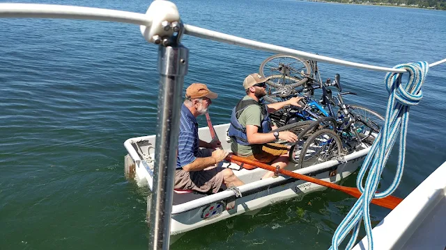 Bikes stacked in dinghy for going ashore