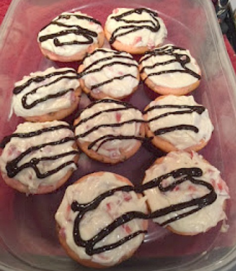 Strawberry infused cupcakes with cream cheese frosting and chocolate drizzle.