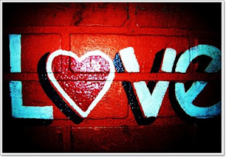 The word love written on a brick wall