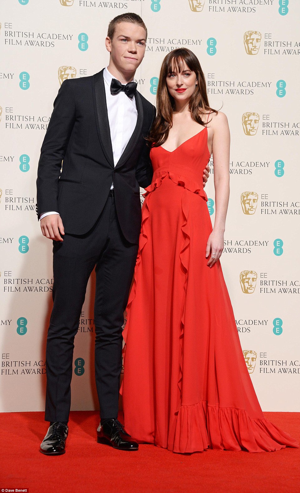 Dakota Johnson goes braless in red at the BAFTAs 2016