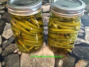 image of pickled garlic scapes, one of the recipes from the garlic scape recipe round up