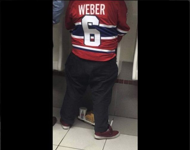 Montreal Canadiens fan peeing in stall over food