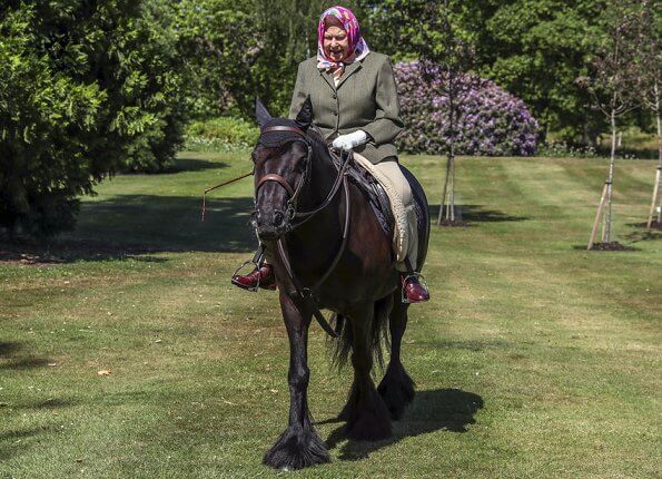 Queen Elizabeth riding one of her ponies called Balmoral Fern, a 14-year-old fell pony, at Windsor Home Park in Windsor Castle