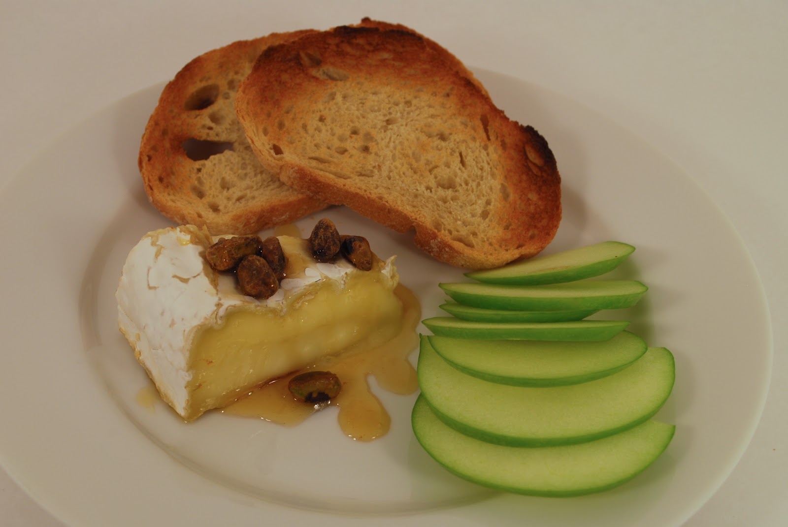 Another Stick of Butter warm brie with honey and pistachios