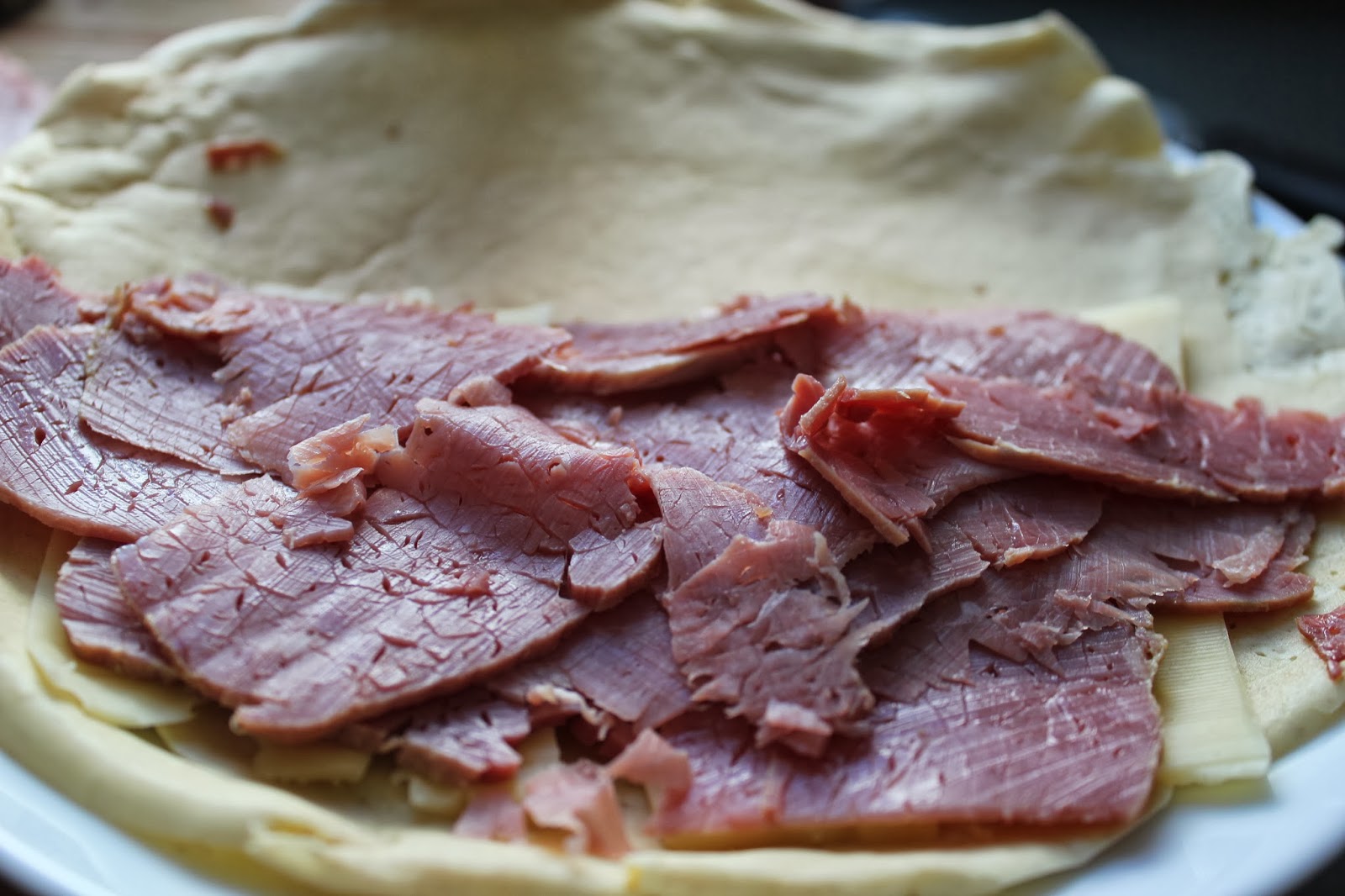 Rye crepes with cheese and corned beef