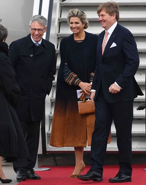 Queen Maxima wore Jantaminiau cape coat and dress