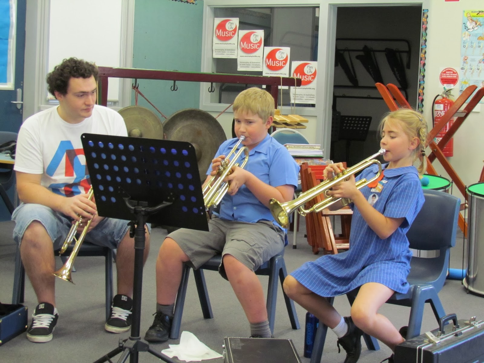 MUSIC Trumpet sounds.