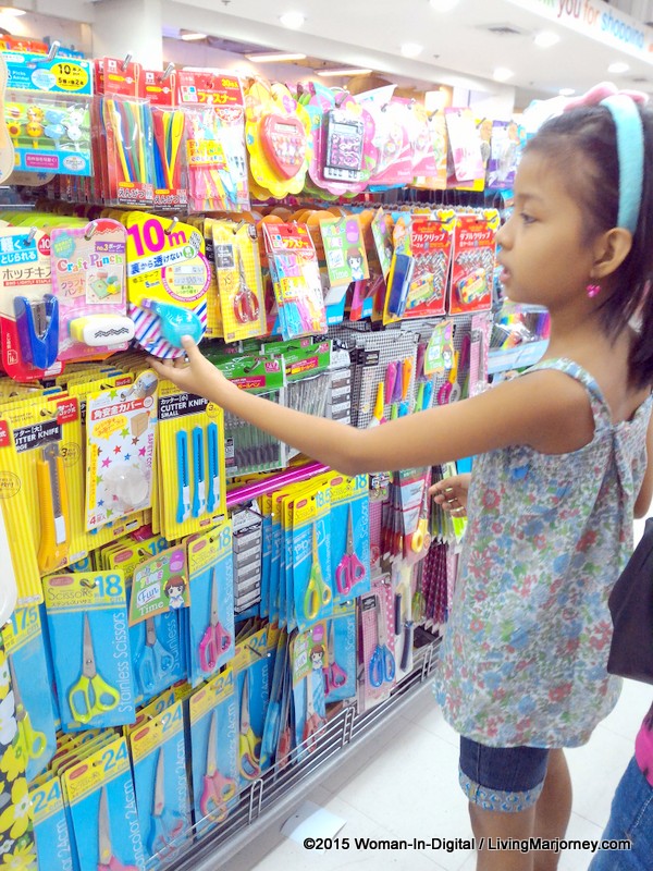 Woman In Digital BackToSchool Fun Shopping at Daiso Japan