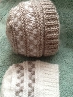 http://www.craftsy.com/pattern/knitting/accessory/check-baby-beanie-hat-with-turn-up-brim/178590