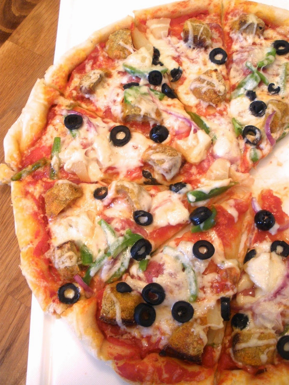 the half cut cook Meatball Pizza