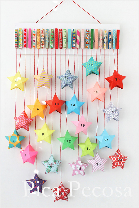 calendario-adviento-diy-trozo-madera-pinzas-ropa-adornadas-washi-tape-cajas-papel-forma-estrella
