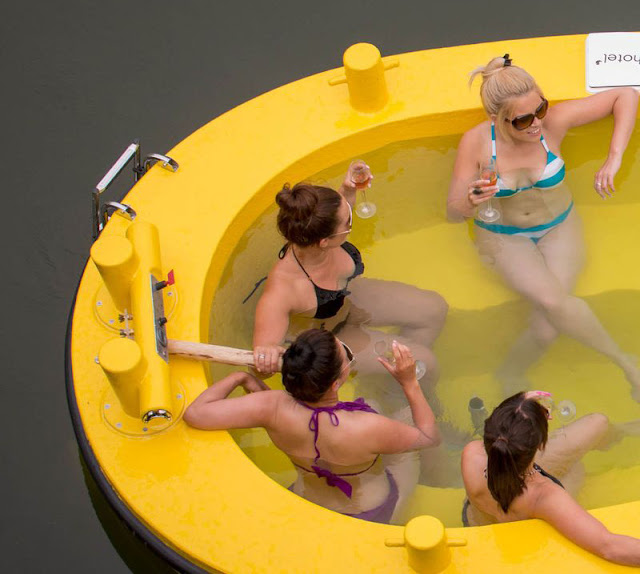 http://www.ifitshipitshere.com/the-hottug-a-motorized-floating-wood-fired-hot-tub/