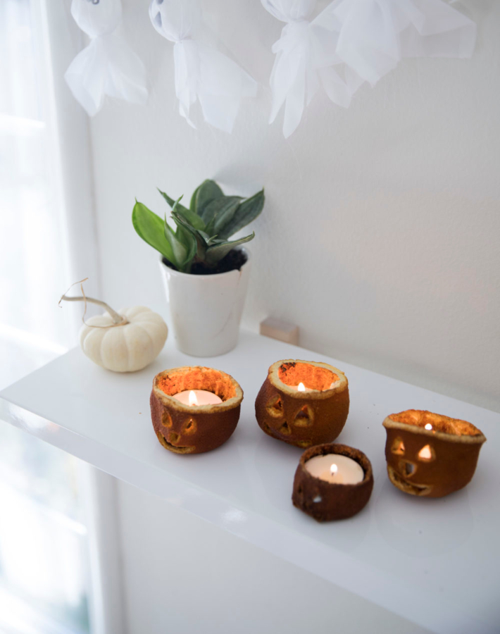 Velas de Halloween hechas con naranjas secas