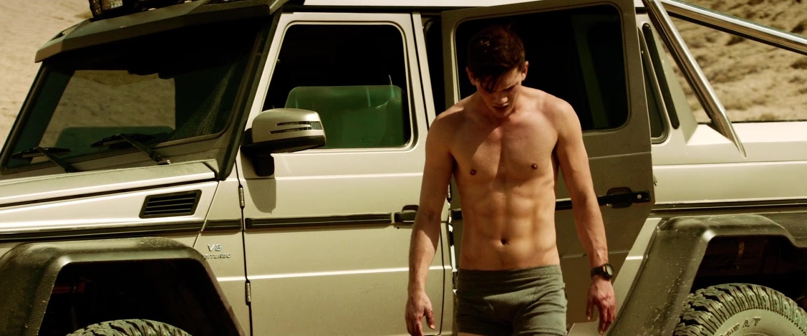 Jeremy Irvine shirtless in Beyond The Reach.