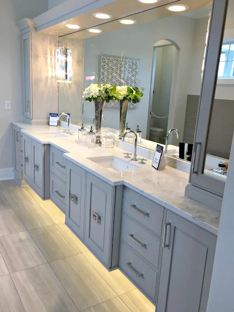 gray bathroom vanity with lights