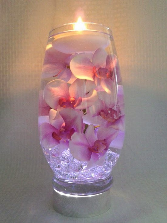 Pink orchids with Submerged purple centers wedding table decorating ideas