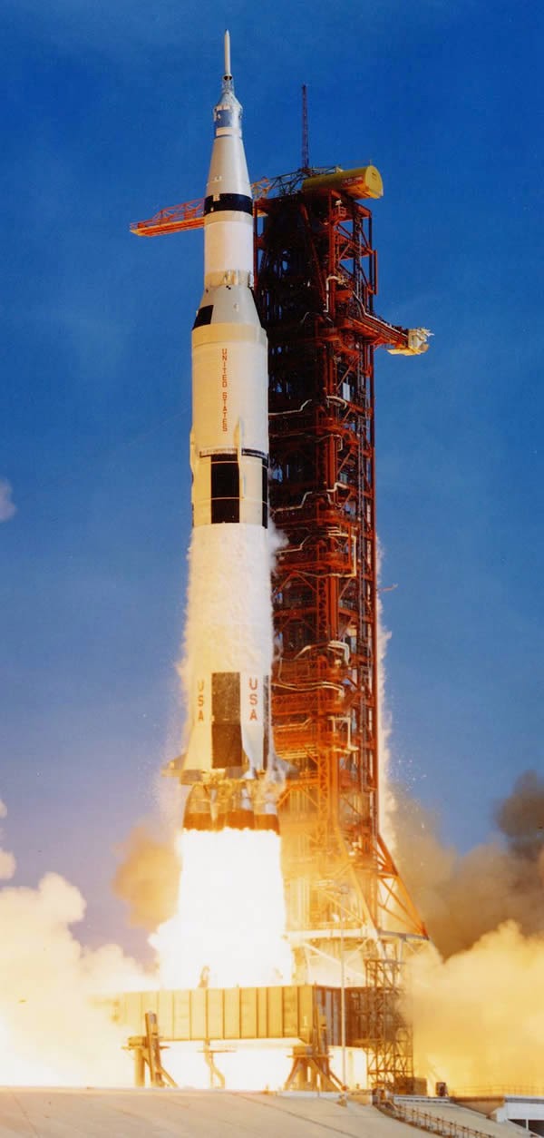 Lift-off of the Saturn V rocket, carrying astronauts Neil Armstrong, Michael Collins, and Edwin "Buzz" Aldrin Jr, along with 6,700,000 pounds (3,039,000 kg) of fuel and equipment into the Florida sky, bound for the Moon, on July 16th, 1969. (NASA) 