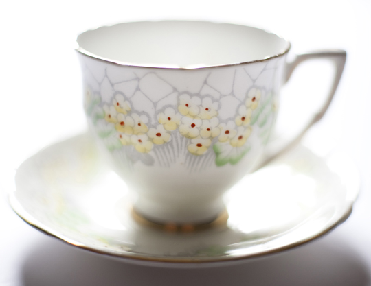 vintage teacup with yellow flowers