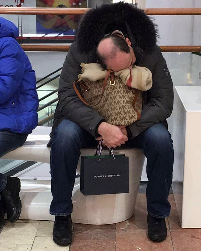 50 Hilarious Pictures Of 'Miserable Men' Waiting While Their Wives Were Shopping