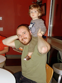 Wesley sitting on Jay's shoulders at Torchy's Tacos