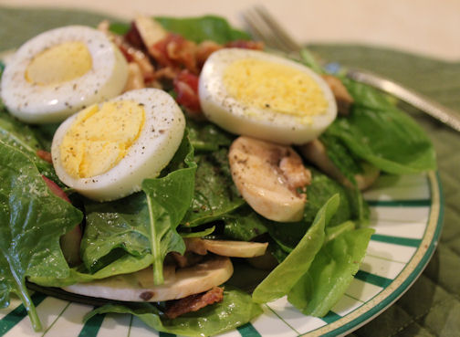 Spinach salad with warm bacon dressing.