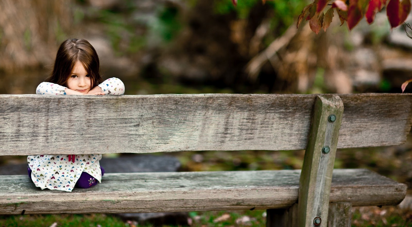 Carewe Child sitting on bench