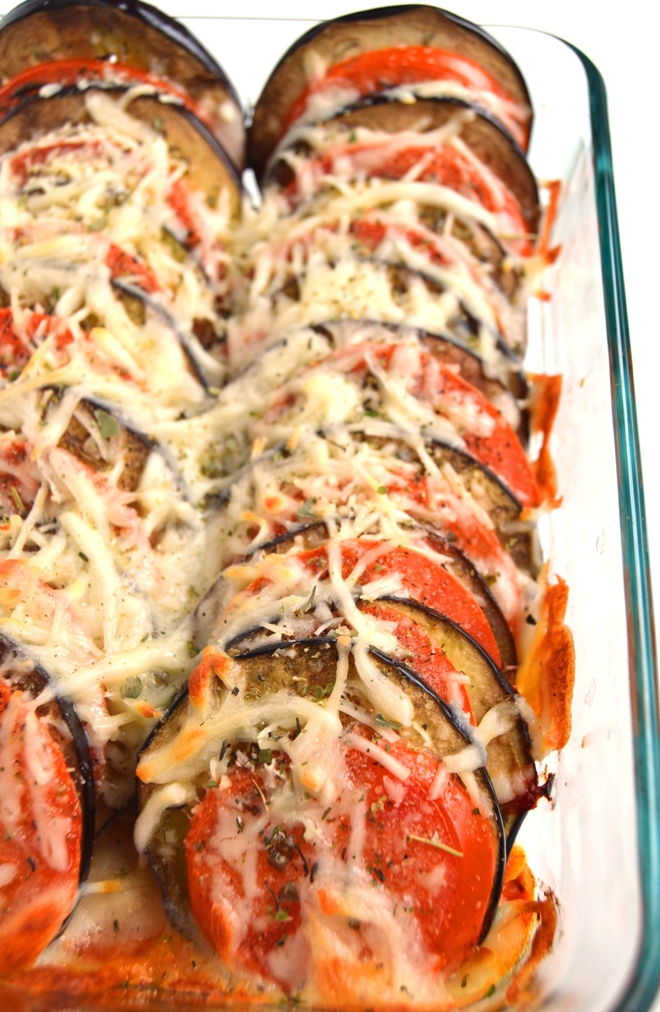 Layered Eggplant Parmesan is a healthier and simpler take on the traditional recipe with stacked tomatoes and eggplant baked with Parmesan and mozzarella cheese, garlic and Italian spices! www.nutritionistreviews.com