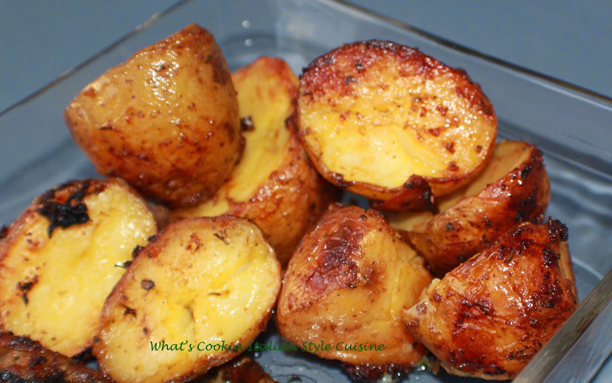 these are potatoes roasted in the oven with Italian seasoning in a glass dish baked
