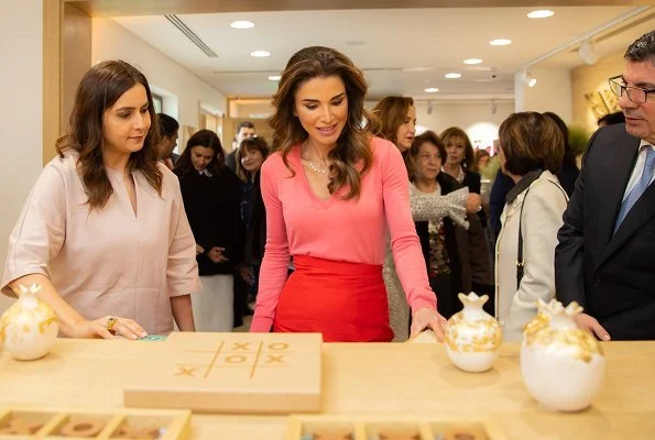 Queen Rania carried Givenchy horizon mini leather satchel bag. Queen Rania wore a red skirt and pink sweater by Givenchy