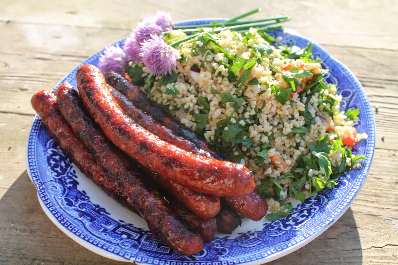 cook, serve, eat tabouleh with merguez sausages
