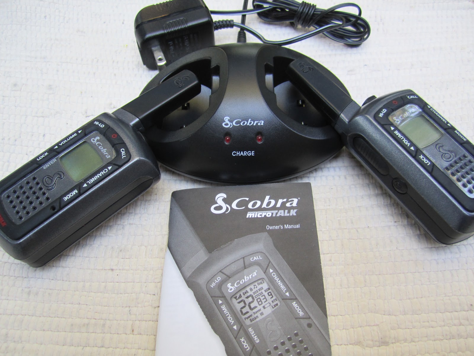 These 2-Way Radios come with 2 radios, the manual, 2 lithium batteries, and  the charging dock. This is the Cobra MicroTalk LI 3900 DX-C.