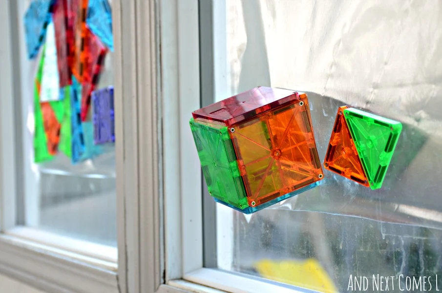 Cube made from Magna-Tiles on a window from And Next Comes L