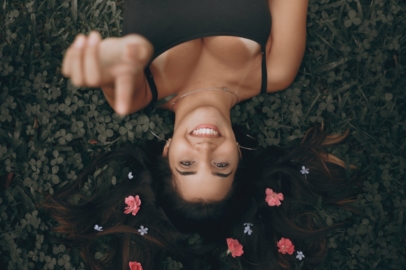 Top View Photo of Woman Laying On Grass